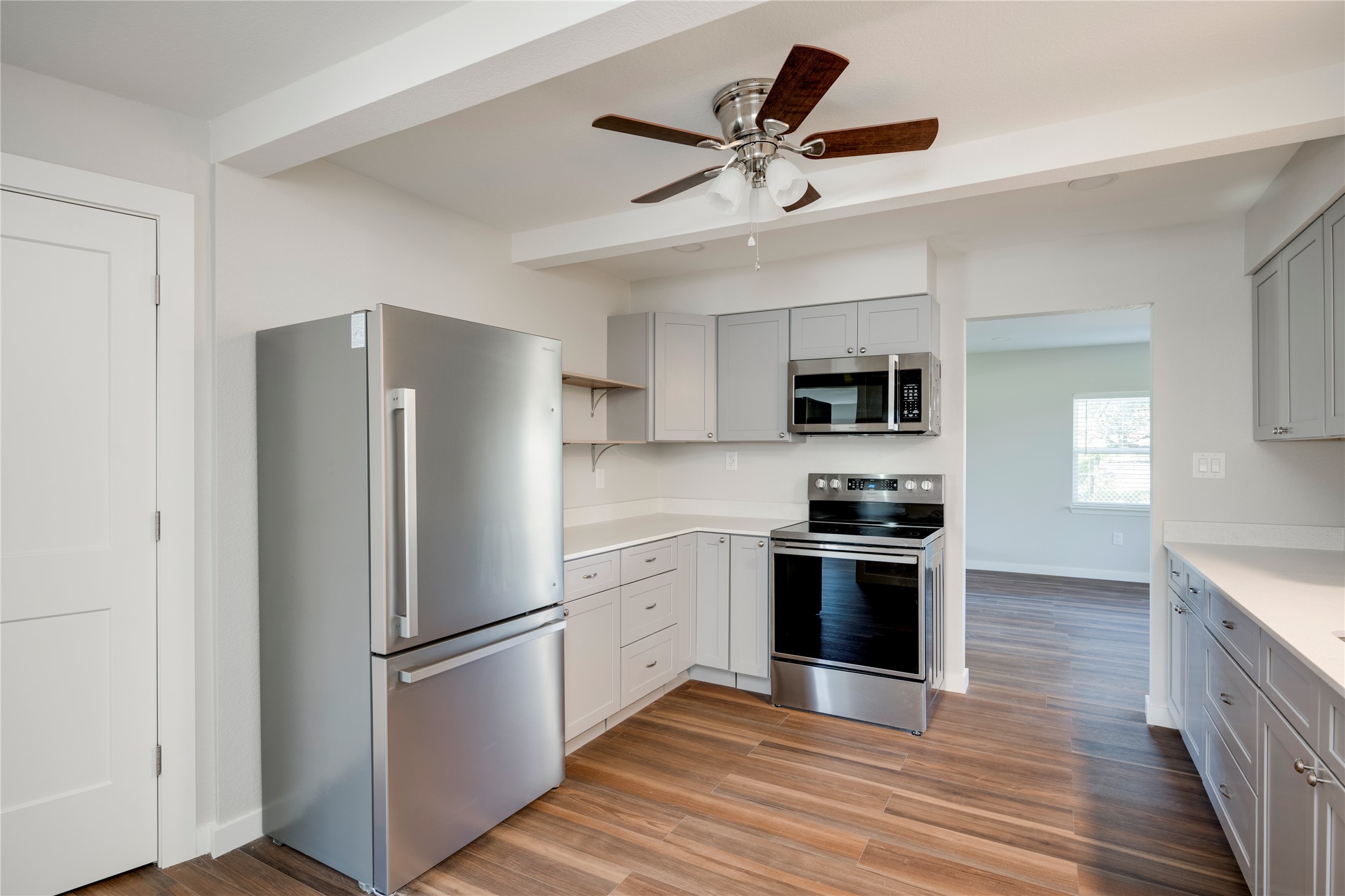 809 North West Street Burnet, TX 78611 - Photo 17 of 40 a kitchen with stainless steel appliances granite countertop a refrigerator and a stove top oven