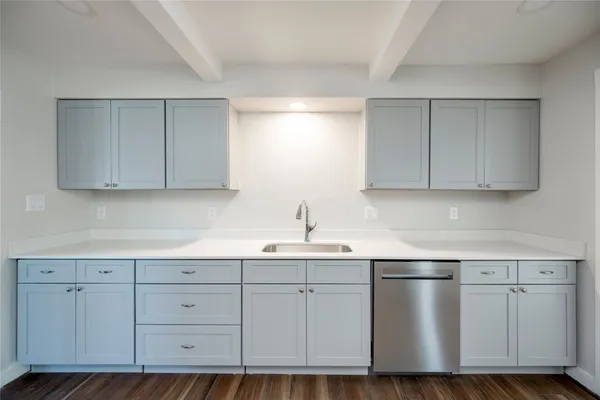 a kitchen with white cabinets