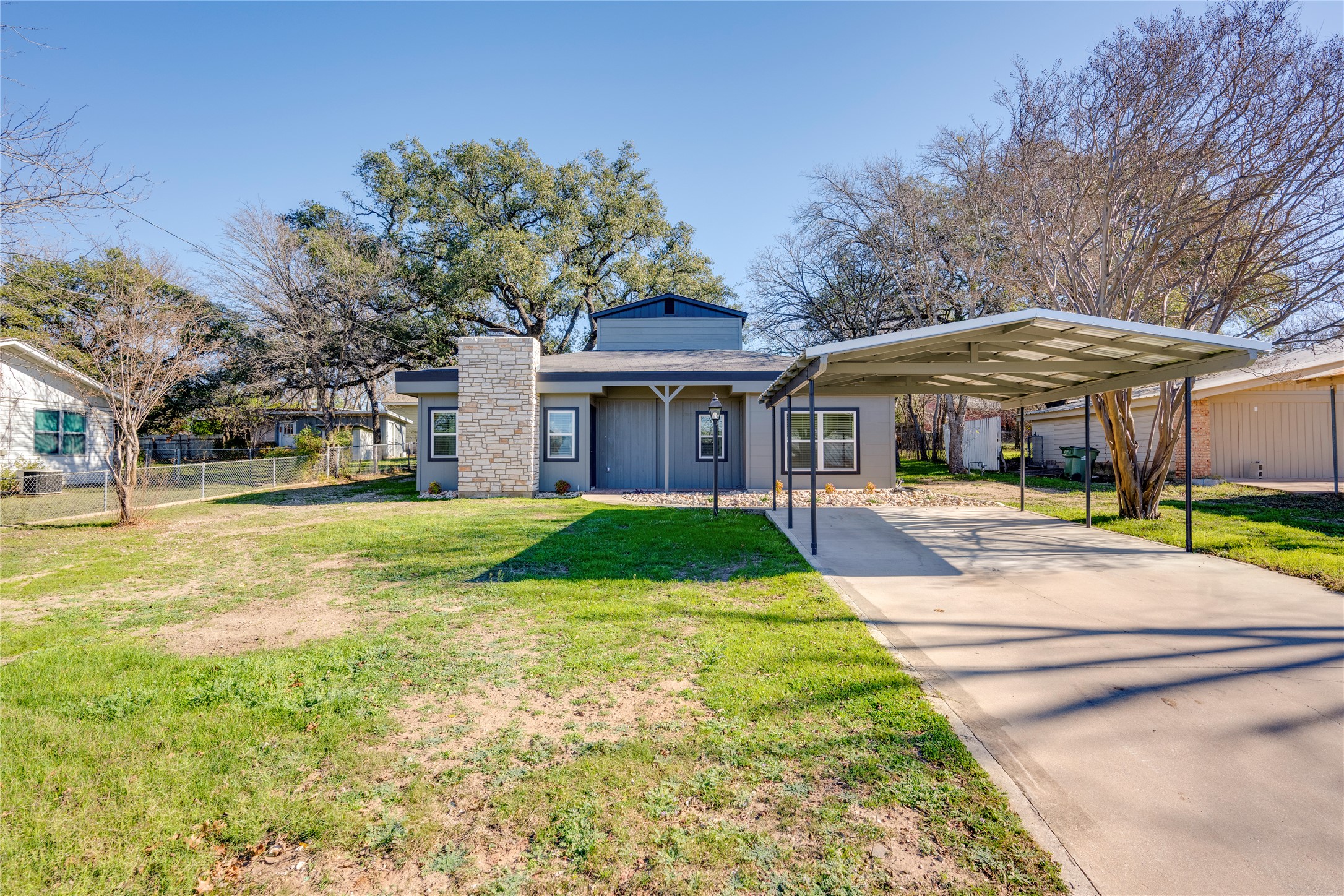 809 North West Street Burnet, TX 78611 - Photo 2 of 40 a view of a white house with a swimming pool