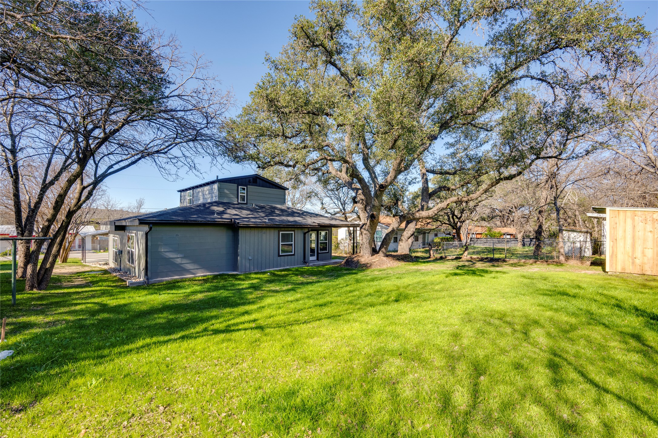 809 North West Street Burnet, TX 78611 - Photo 37 of 40 a yellow house in middle of the forest
