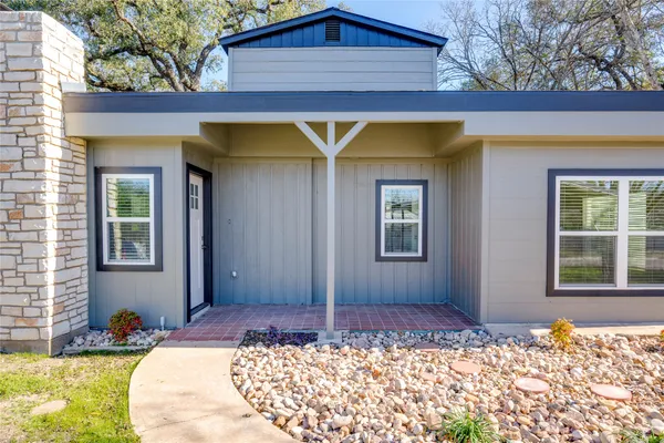 a house view with a backyard space