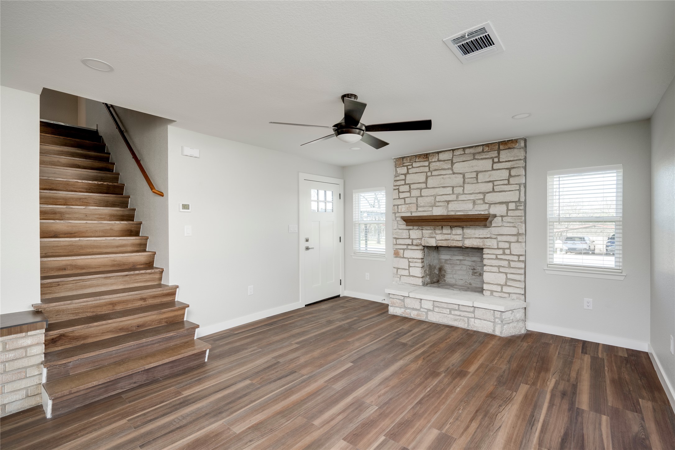 809 North West Street Burnet, TX 78611 - Photo 9 of 40 a view of an empty room with wooden floor fireplace and a window