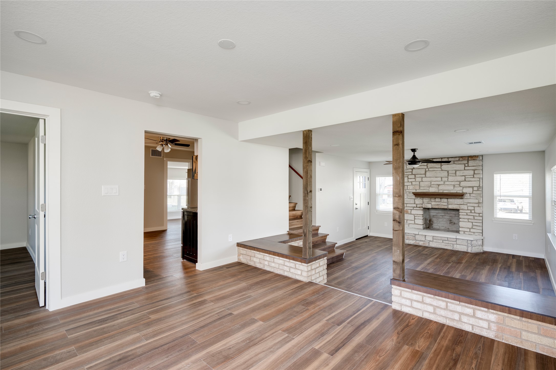 809 North West Street Burnet, TX 78611 - Photo 10 of 40 a view of a livingroom with wooden floor and staircase