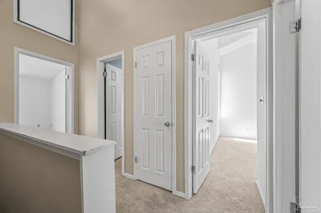 a view of a bathroom from a hallway