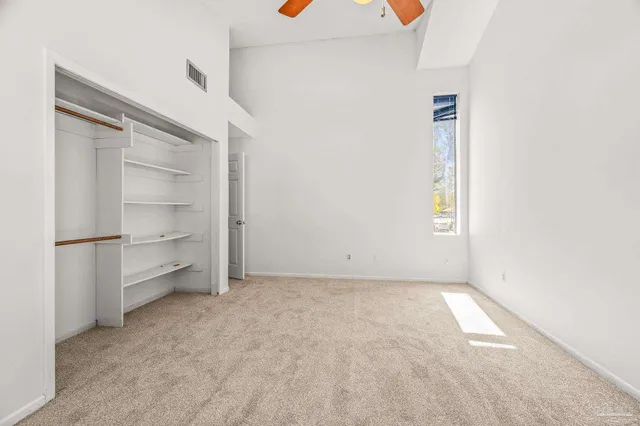 a view of an empty room and a windows