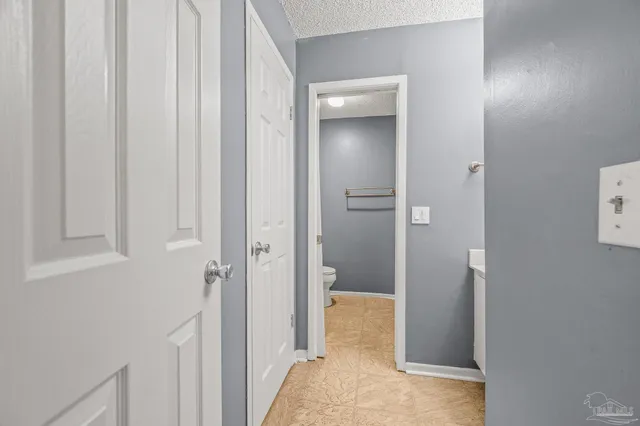 a view of a bathroom from a hallway