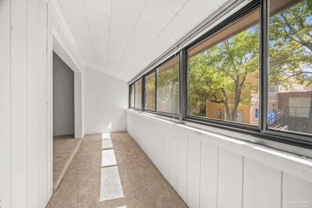 a view of a room with a large window