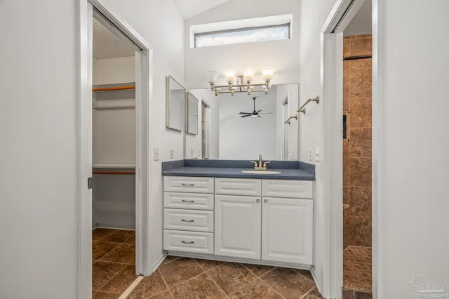 a bathroom with a double vanity sink and mirror