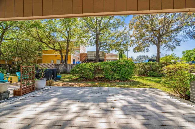 a view of a backyard with pathway