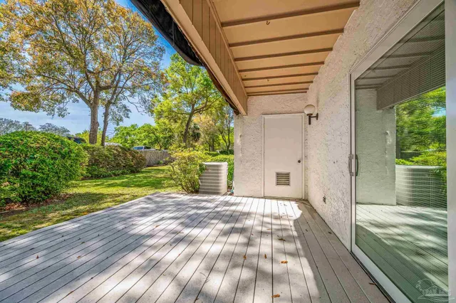 a view of a porch and garden