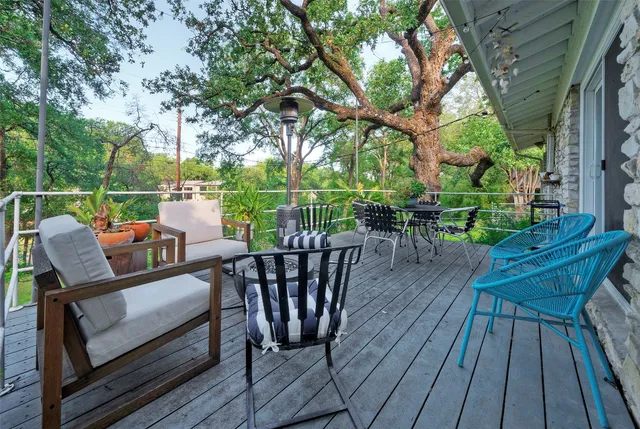 a view of a chairs and table on the wooden floor