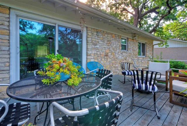 a view of a chairs and table in the patio