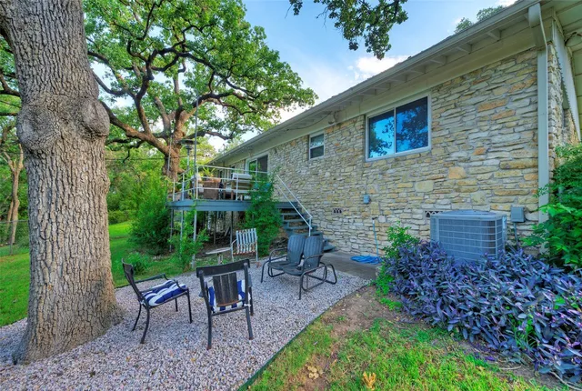 a view of an chairs and table in the patio