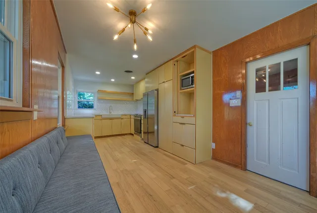 a view of a kitchen with a dishwasher and cabinets