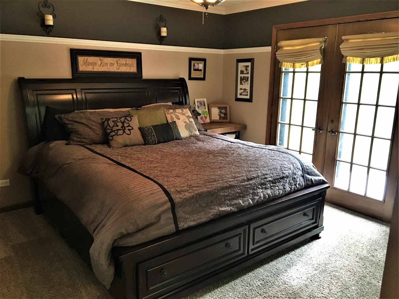 810 East Old Wagon Road Byron, IL 61010 - Photo 17 of 25 a bed sitting in a bedroom next to a window