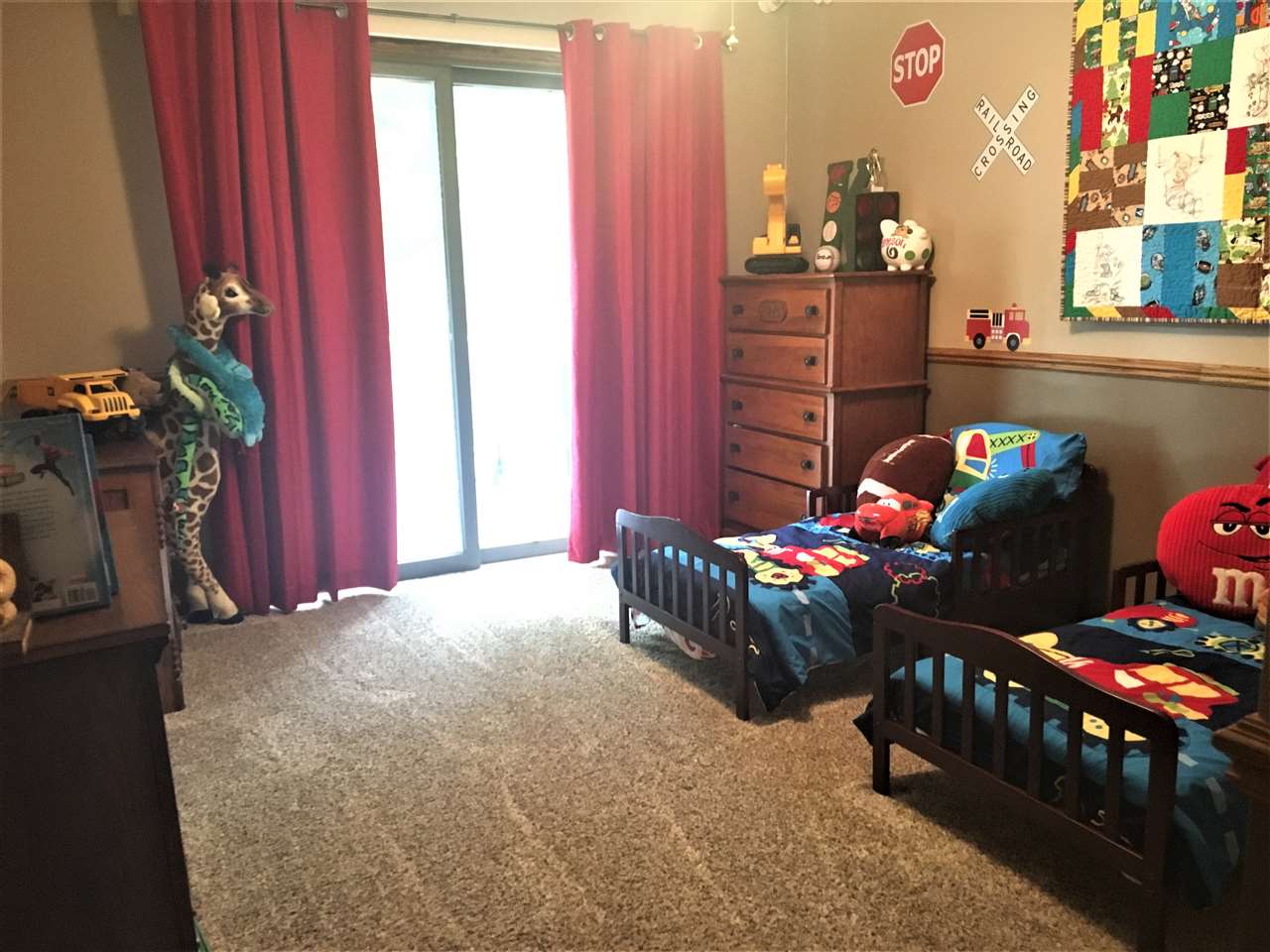 810 East Old Wagon Road Byron, IL 61010 - Photo 5 of 25 a bedroom with furniture and a window