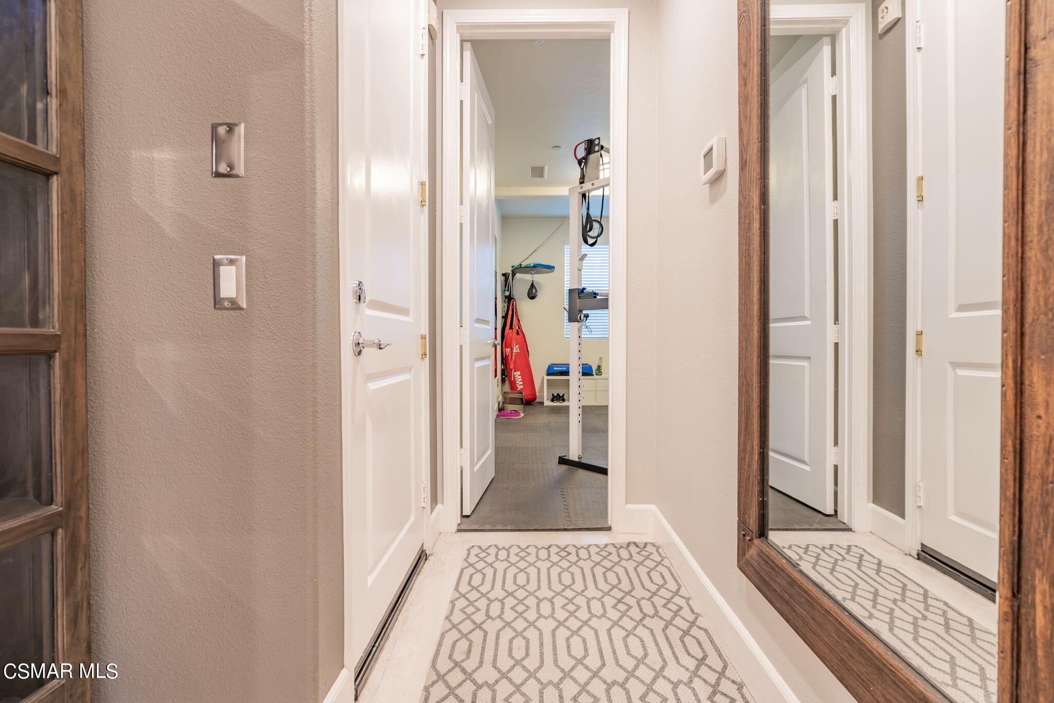4064 Galapagos Way Oxnard, CA 93035 - Photo 17 of 55 a view of a bedroom from a hallway