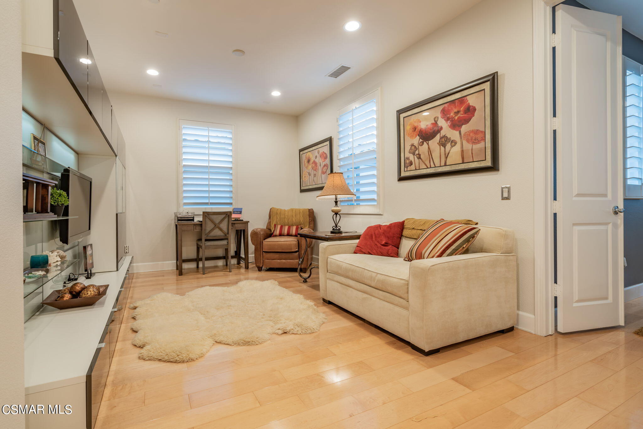 4064 Galapagos Way Oxnard, CA 93035 - Photo 21 of 55 a living room with furniture and a flat screen tv