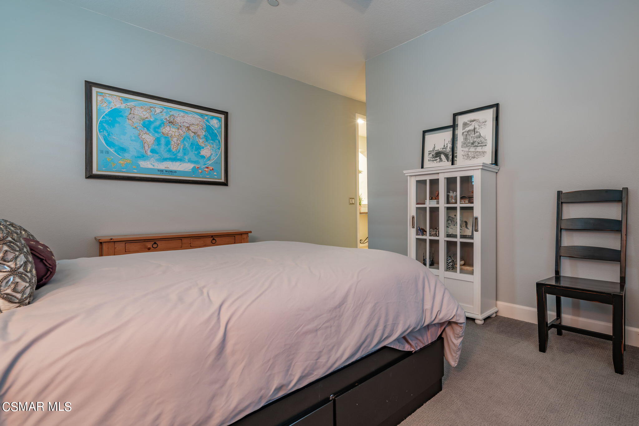 4064 Galapagos Way Oxnard, CA 93035 - Photo 38 of 55 a bedroom with a bed a bookshelf and a bookshelf