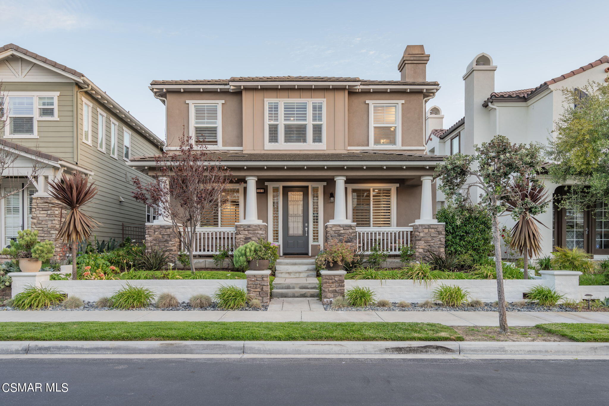 4064 Galapagos Way Oxnard, CA 93035 - Photo 54 of 55 a front view of a house with a yard and garage