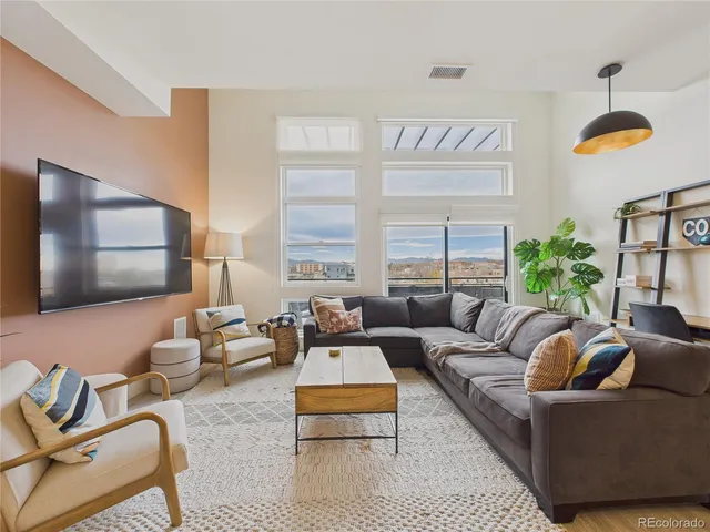 a living room with furniture or couch and a window