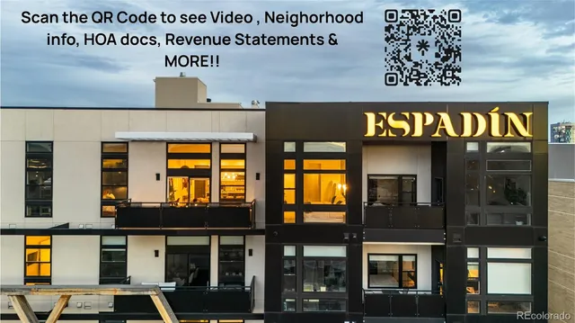 a front view of a building with retail shop and windows