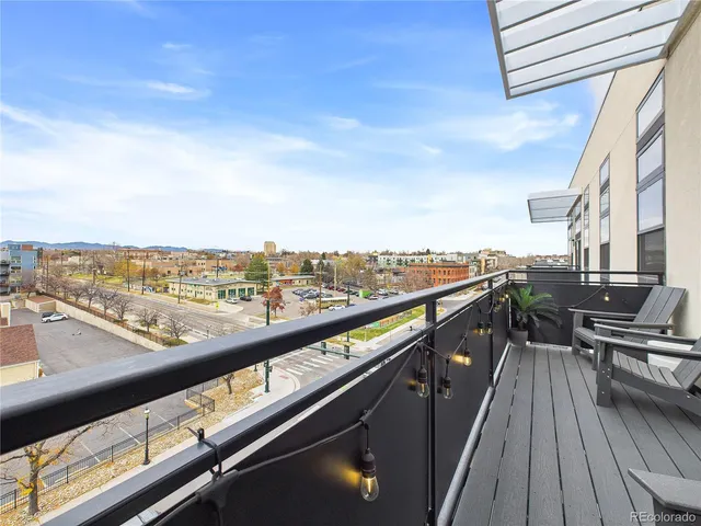 a bedroom with a bed and a potted plant