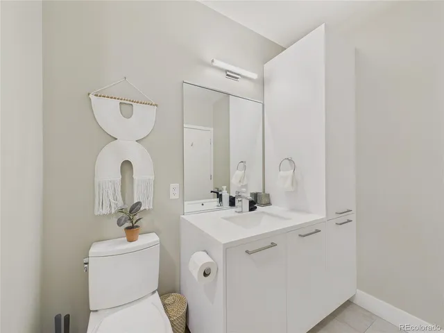 a spacious bedroom with a bed a couch and dresser