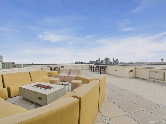a balcony with furniture and city view