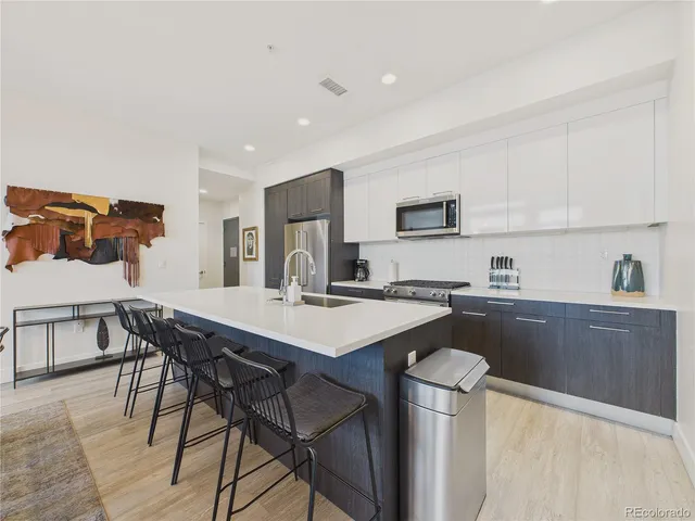 a kitchen with a table and chairs in it