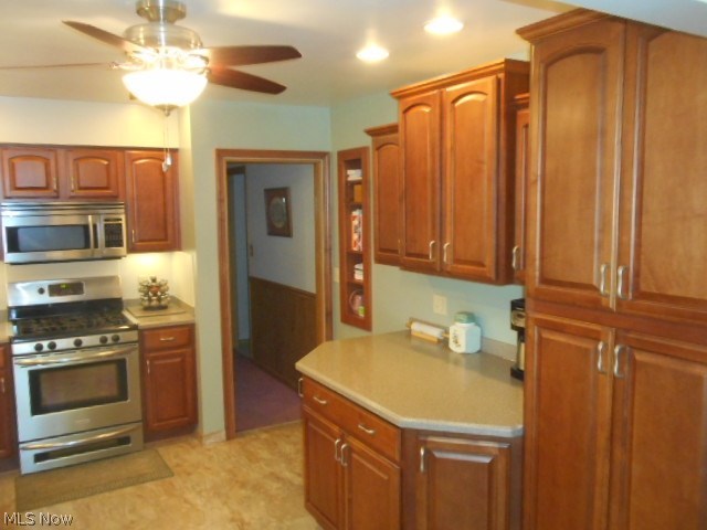 8560 Royal Ridge Drive Parma, OH 44129 - Photo 12 of 21 Additional Kitchen amenities include the lighted ceiling fan, built-in cook book shelves, work station, and pantry.