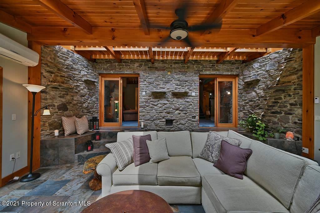 453 Freeman Road Dalton, PA 18414 - Photo 23 of 154 a view of a couches with the backyard of the house