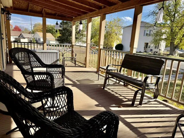 a view of a chairs and table in the balcony