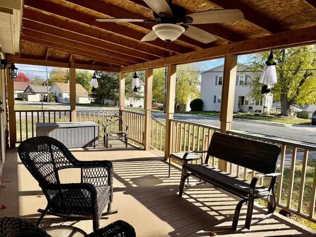 a view of a chairs and table in the balcony