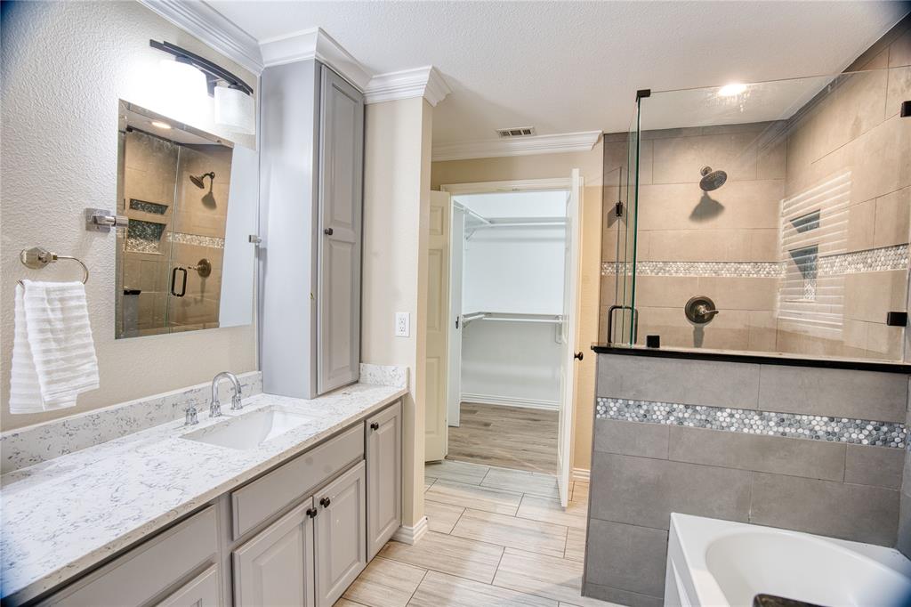 420 North Road Kennedale, TX 76060 - Photo 24 of 36 Bathroom featuring a stall shower, vanity, ornamental molding, a walk in closet, and a bath