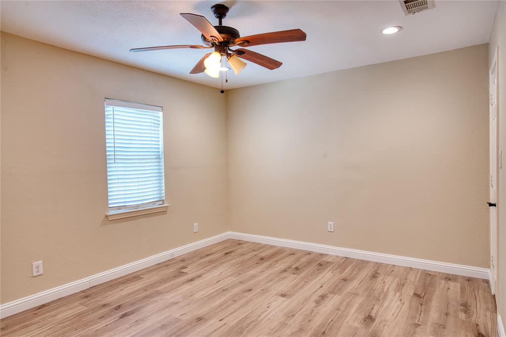 420 North Road Kennedale, TX 76060 - Photo 31 of 36 Unfurnished room featuring light wood-type flooring, a ceiling fan, and recessed lighting