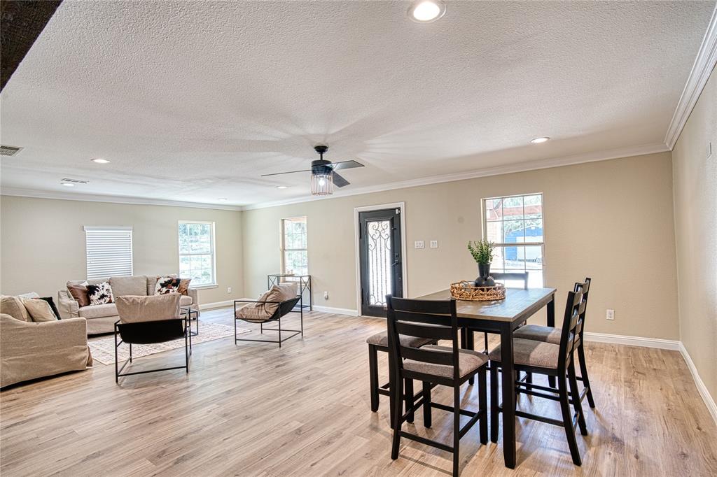 420 North Road Kennedale, TX 76060 - Photo 6 of 36 Dining room with recessed lighting, healthy amount of natural light, a ceiling fan, light wood-style flooring, and ornamental molding