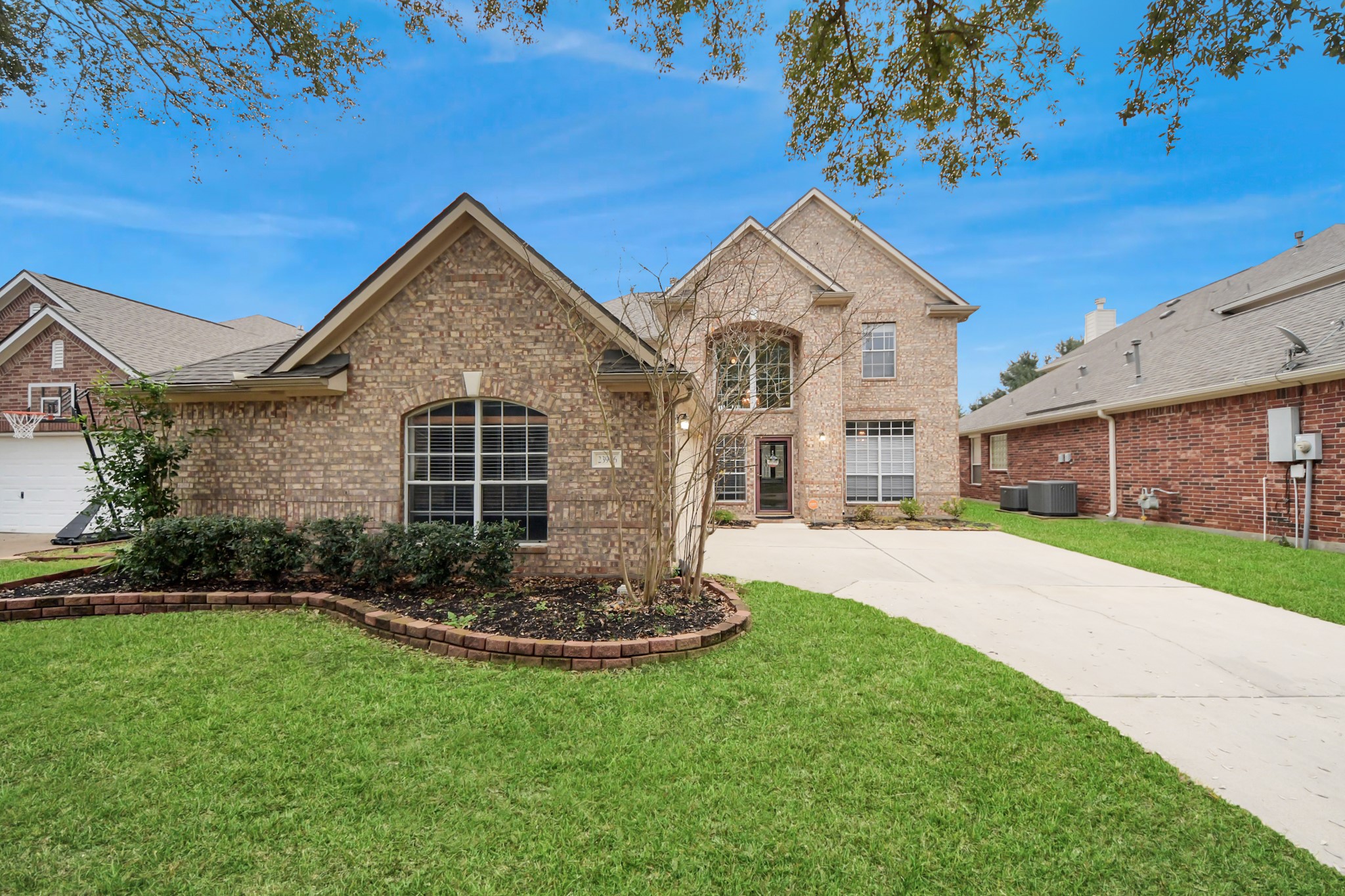 23906 Indian Crest Court Katy, TX 77494 - Photo 1 of 32 a front view of a house with a yard