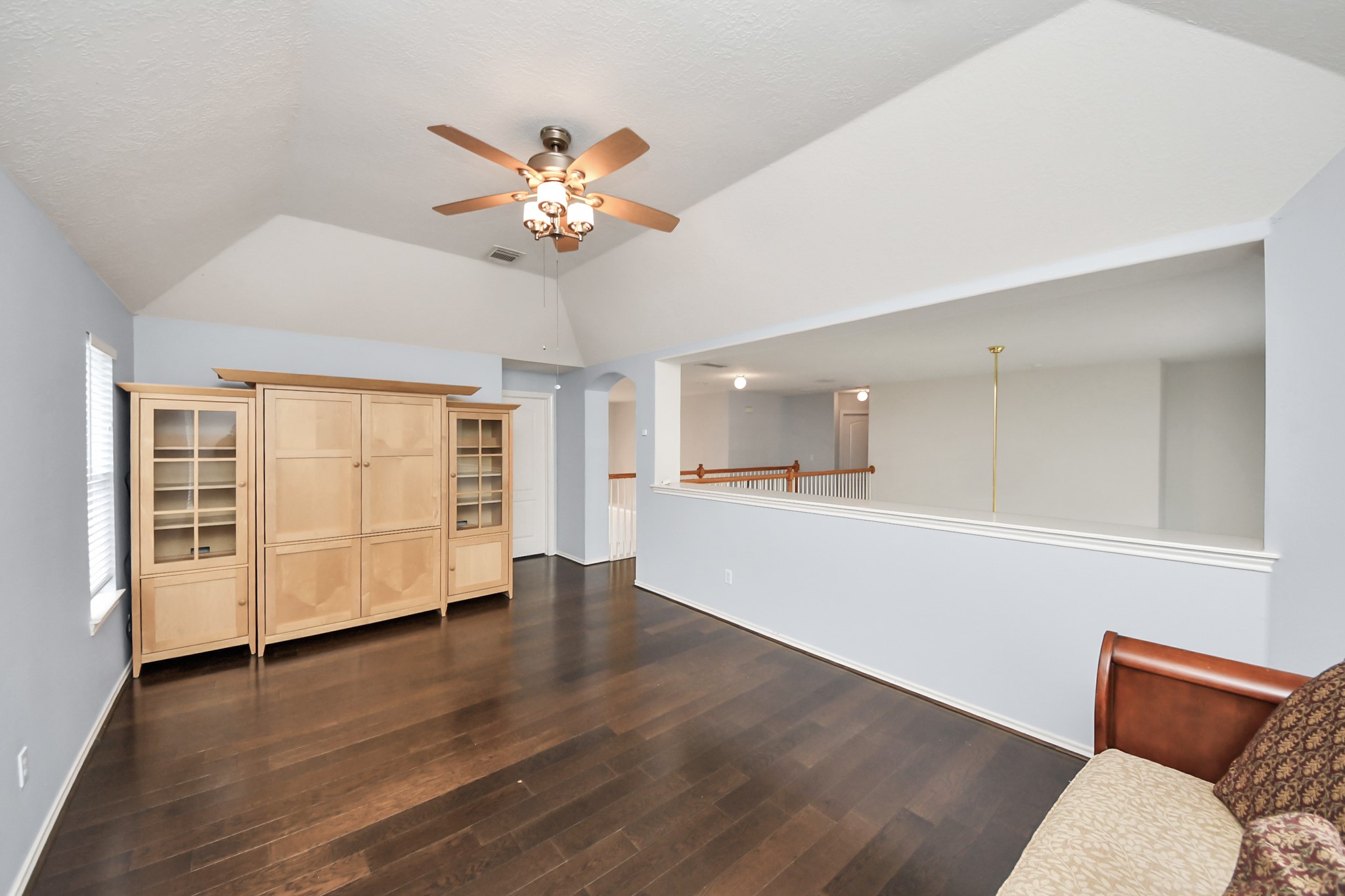 23906 Indian Crest Court Katy, TX 77494 - Photo 15 of 32 a view of an empty room with a window and wooden floor