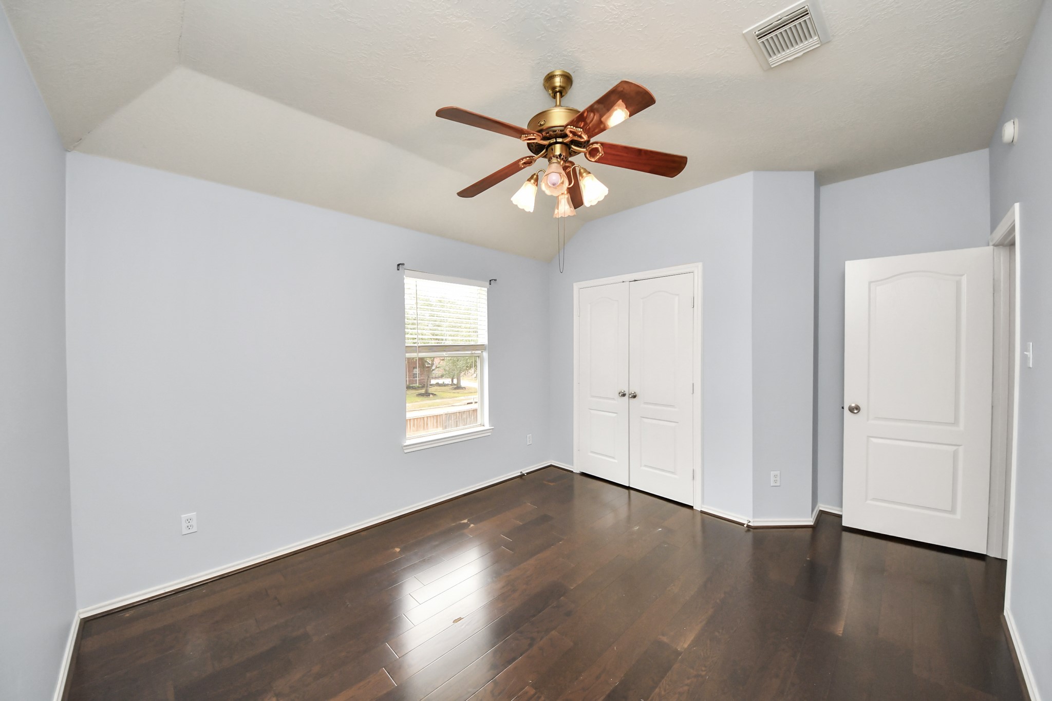 23906 Indian Crest Court Katy, TX 77494 - Photo 21 of 32 a view of a room that has a window and wooden floor
