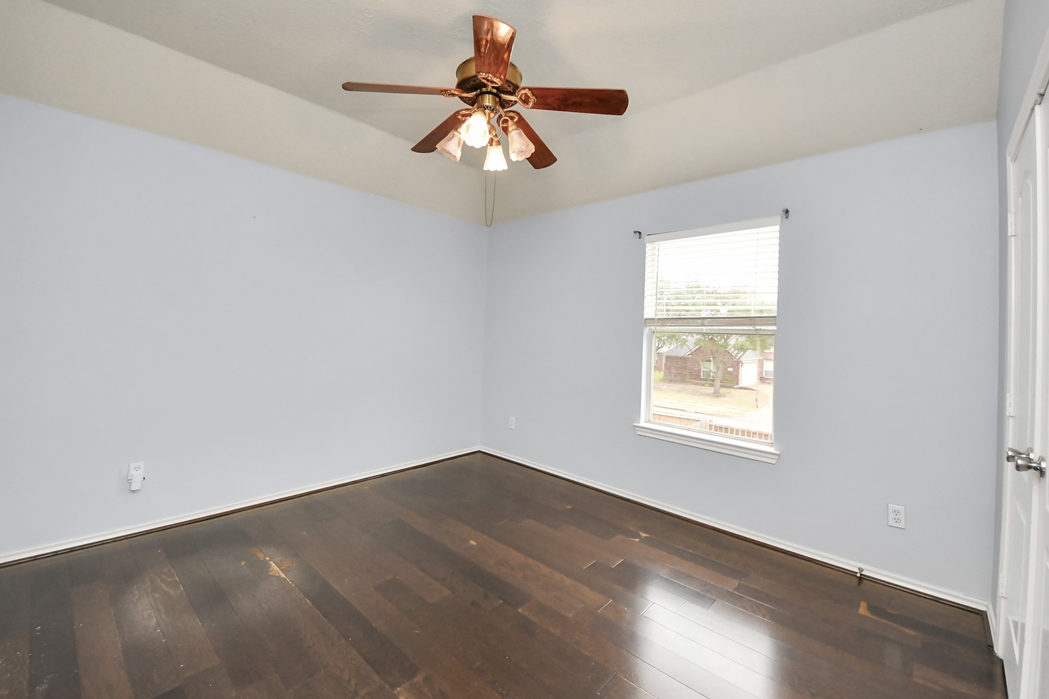 23906 Indian Crest Court Katy, TX 77494 - Photo 22 of 32 an empty room with a window and a fan
