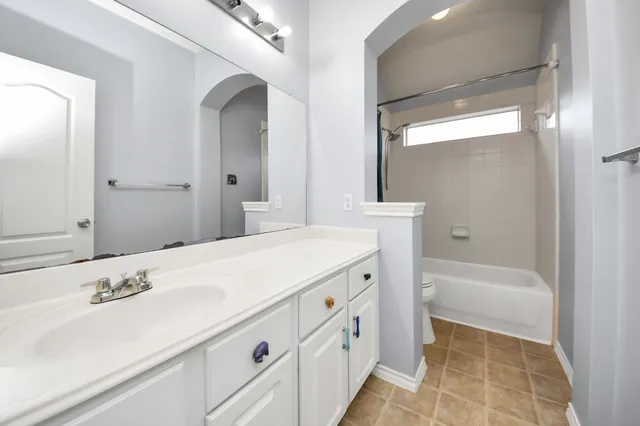 a bathroom with a sink and a bathtub
