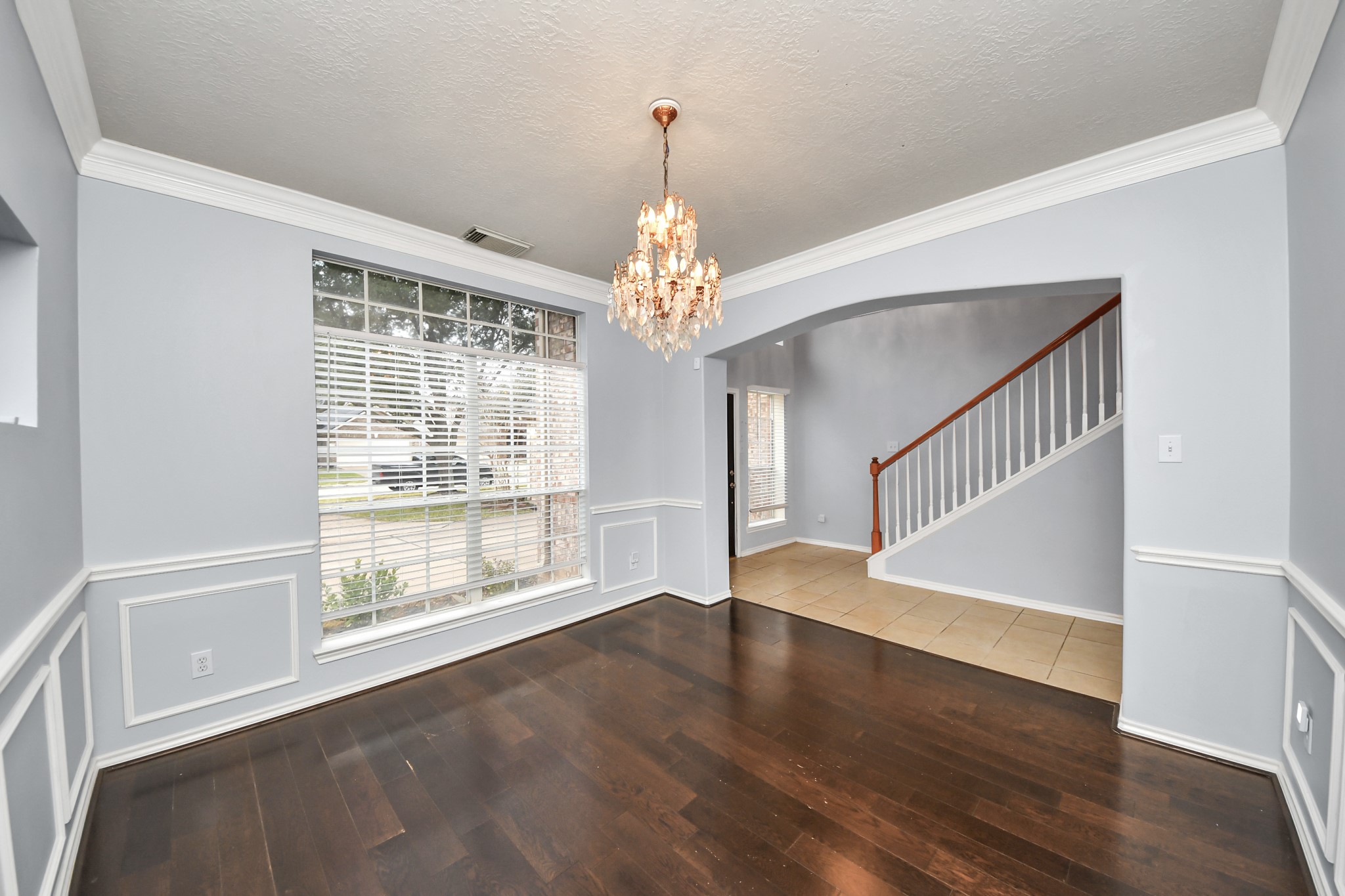 23906 Indian Crest Court Katy, TX 77494 - Photo 4 of 32 a view of an empty room with wooden floor and a window