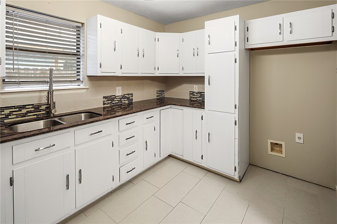 314 Moss Street Bryan, TX 77803 - Photo 7 of 18 a view of cabinets with wooden floor