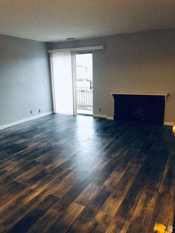 88 West 50 South, Unit B5 Centerville, UT 84014 - Photo 19 of 33 Unfurnished living room featuring dark wood finished floors and baseboards