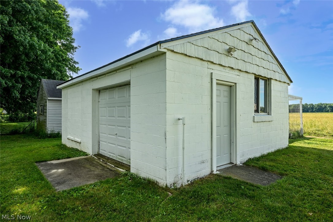 5803 Doylestown Road Seville, OH 44273 - Photo 27 of 37 Fantastic outbuilding is divided so one side is a work area and the other side is an office. It features a concrete floor, heat, electric and air conditioning.