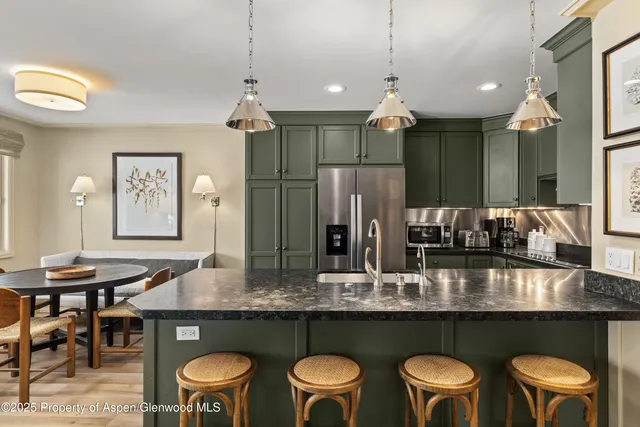 a dining table with chairs and window