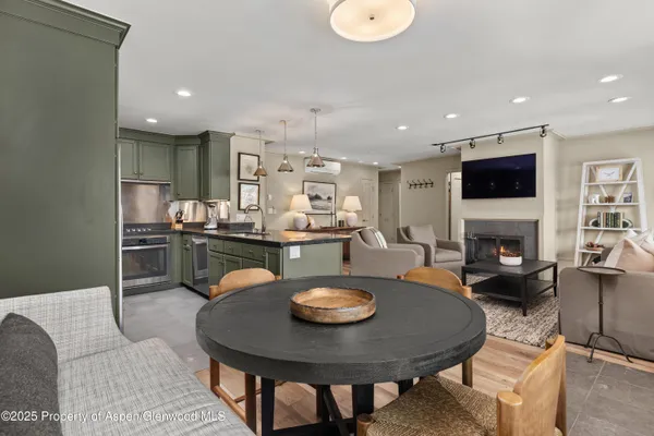 a kitchen with a table and chairs