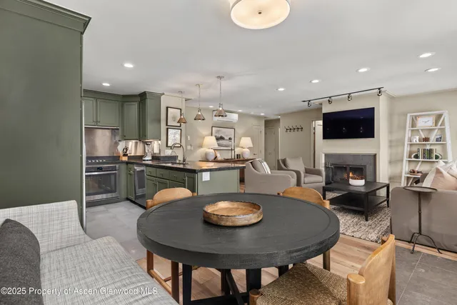 a kitchen with a table and chairs