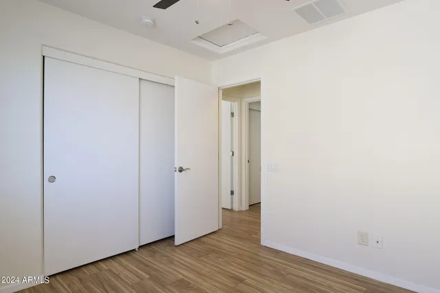 a view of hallway with wooden floor
